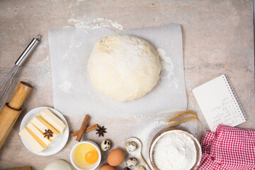Beat flour and kitchen utensils, a baking dish, a rolling pin with eggs on the table. Baking, cooking concept. Chef making bread and gingerbread cookies. The cook kneads and rolls the dough.