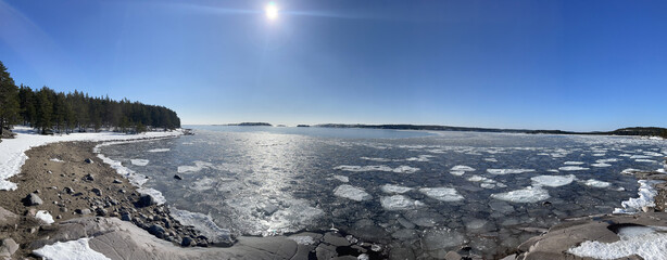 Scenic panorama of lake Ladoga skerries in early spring, Northern Karelia