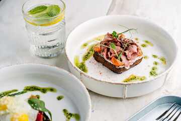 Smorrebrod, Danish open sandwich with roast beef, sweet onion and cherry tomato