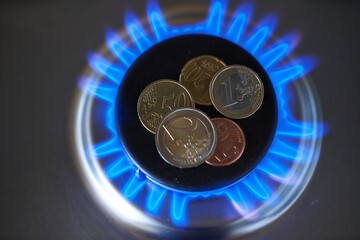Natural gas price, top down view of gas stove. Methane gas prices