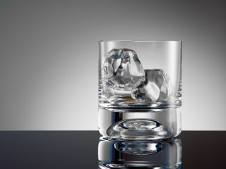 Empty whiskey glass with ice cubes ready to be filled.