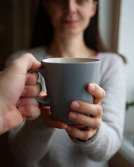 person with cup of coffee