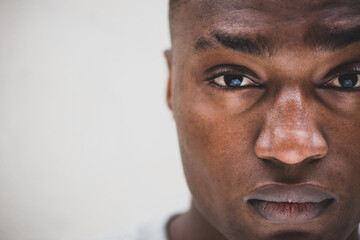 Close up part face portrait serious African american man staring