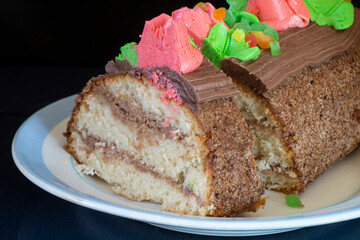 Sweet cake on a plate with a blue stripe