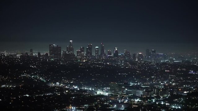 The iconic Los Angeles skyline cityscape at night from a distance