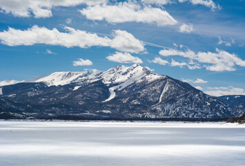 Fototapeta na wymiar Colorado mountain views over frozen Dillon Lake Reservoir on a bright spring day near Frisco.