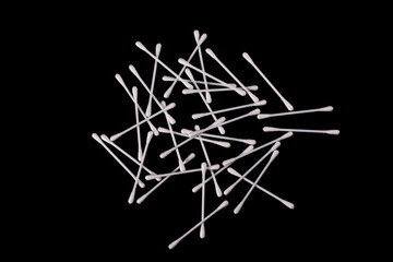 Cotton buds isolated on black background.