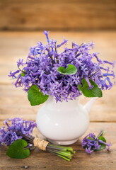 Hyacinth flowers in the pot on the wooden table