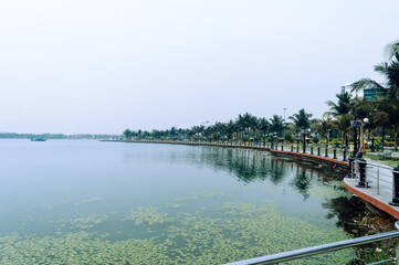 Fototapeta premium Lakeside promenade Landscape view along side lake inside Eco tourism park Kolkata India South Asia