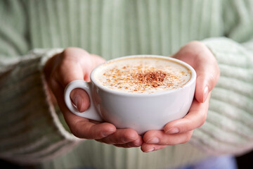 woman with cup of cappuccino