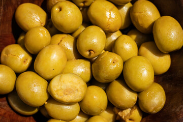 Some seasoned green olives, typical Spanish snack, always eaten in parties