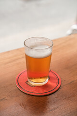 Tap beer served on a glass in a bar.