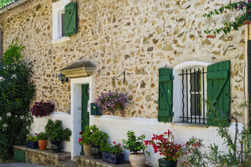 Fototapeta na wymiar Windows with wrought iron bars, Grimaud, Var, Provence region, France