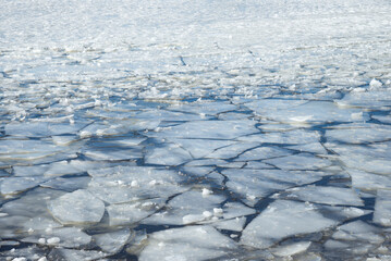 Melting ice on a reservoir on a sunny April day