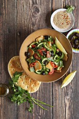 Fattoush Salad. Lebanese vegetables salad with roasted flatbread. Selective focus