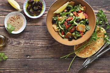 Fattoush Salad. Lebanese vegetables salad with roasted flatbread. Selective focus