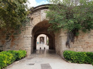 Obraz na płótnie Canvas Passageway from the sea-side parc de la mar in front of the city walls to the old town of Palma, Mallorca, Balearic Islands, Spain