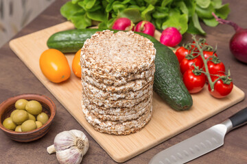 Ingredients for cooking vegan vegetarian toasts with different vegetables and whole grain bread on kitchen table. Healthy diet food concept
