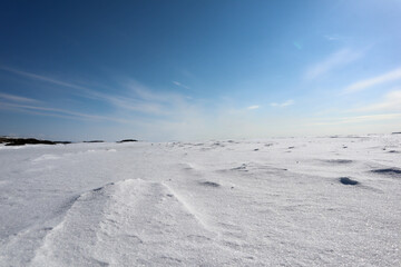 Obraz premium landscape with snow covered lake Ladoga under clear blue sky