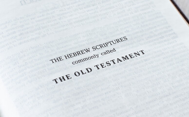 The Old Testament Hebrew Scripture page in Holy Bible Book. Christian text on white. A close-up.