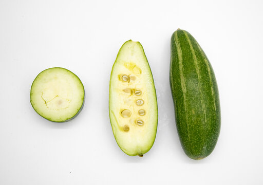 some pieces of pointed gourd isolated on white background