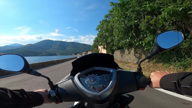 Rider driving scooter first-person view
