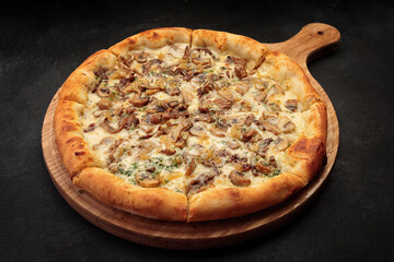 Pizza with mushrooms and cheese, on a wooden board