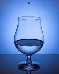 transparent cup blue with a drop