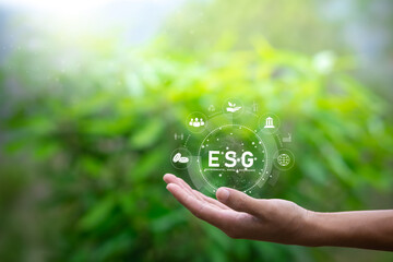 ESG icon concept in the hand of human for environmental, social, and governance in sustainable and...