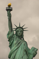 Fototapeta premium Statue of Liberty standing on a cloudy day
