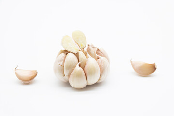 Two heads of garlic by close up isolated on a white background.