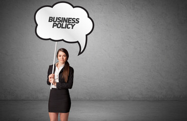 business person in casual holding road sign