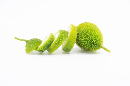 slices spiny gourd over on white background, kakrol