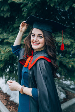 Portrait of a beautiful young woman magister is graduating from university. High school graduation