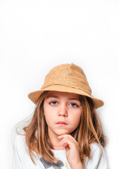 Little girl with hat looking at camera.