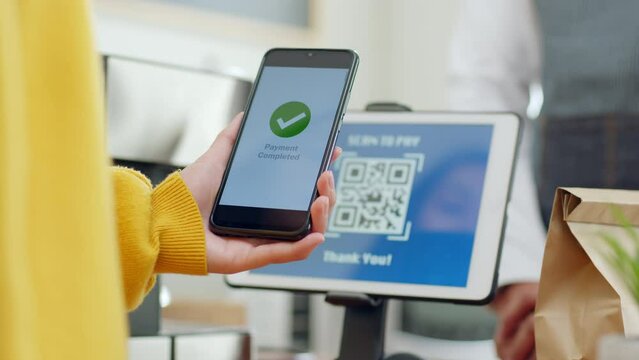 QR code payment, customer using smartphone for paying at shop