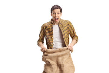 Excited young man jumping in a sack