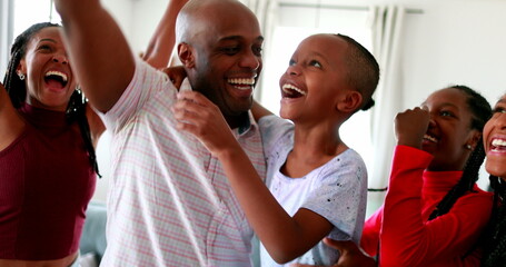 Happy black family receiving good news in celebration