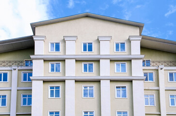 Beautiful residential building against the blue sky. Multi-storey building, Russia.