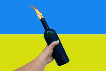 Hand of peace hold a fire bottle over Ukraine flag  ,Pray For Ukraine. Save Ukraine.