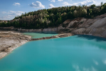 Quarry and golden beach with beautiful blue, turquoise water. Wedding couple walking. Ukraine. concept, vacation, travel, nature and landscape