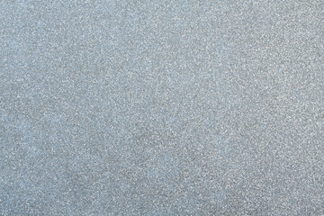 Gray silver glitter surface. Texture. View from above. Closeup