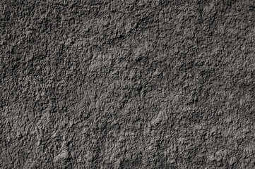 gray background. in the photo, gray decorative plaster on the wall.