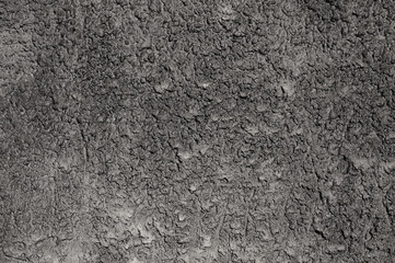 gray background. in the photo, gray decorative plaster on the wall.