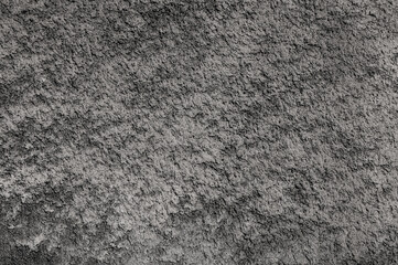 gray background. in the photo, gray decorative plaster on the wall.