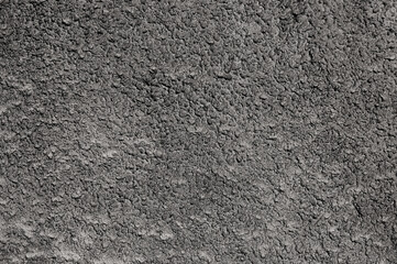 gray background. in the photo, gray decorative plaster on the wall.