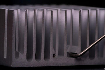 Anodized aluminum coolers isolated on black background. Alu heat sinks for cooling of electronic...