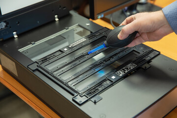 Cleaning the scanner and photographic films from dust. Converting an image to digital form.
