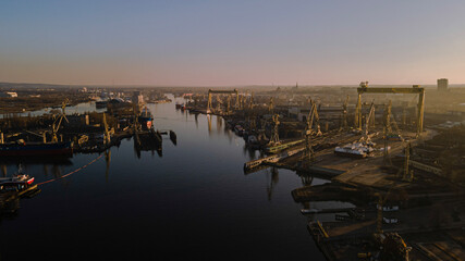 sunset over the river in Harbour, port, ship transport,  - obrazy, fototapety, plakaty