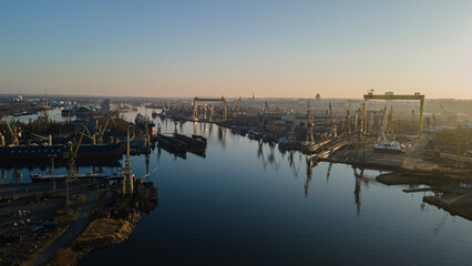 sunset over the river in Harbour, port,ship transport,  - obrazy, fototapety, plakaty